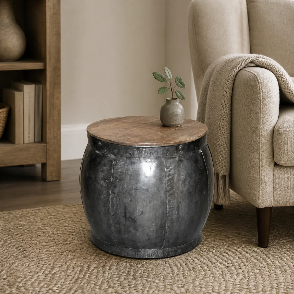 Zinc Drum Side Table staged in a curated room setting one.