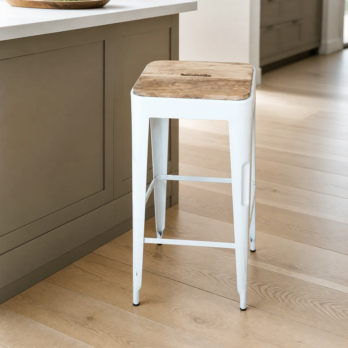 White Foundry Bar Stool staged in a curated room setting one.