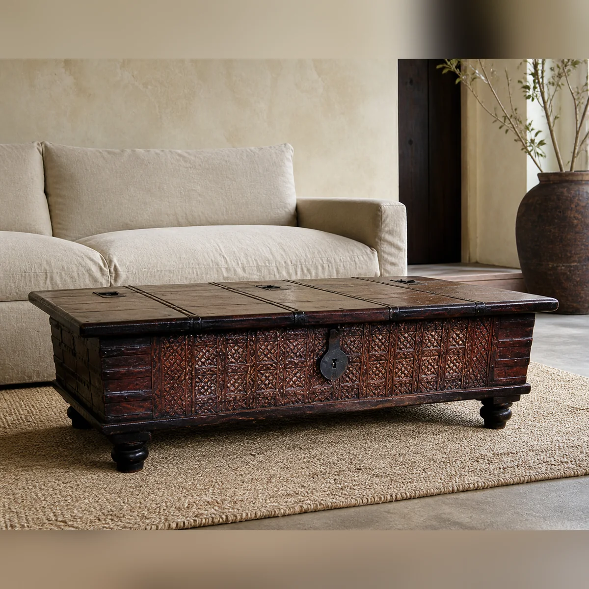 Damara Panelled Coffee Chest staged in a curated room setting one.
