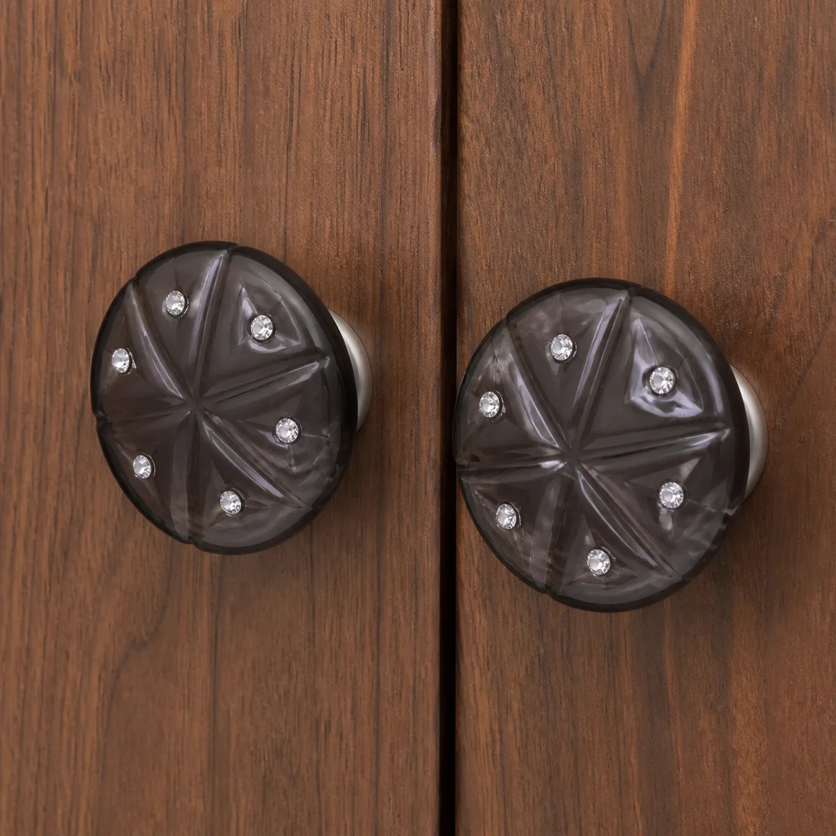 Faceted Dark Cabinet Knob Pair staged in a curated room setting one.
