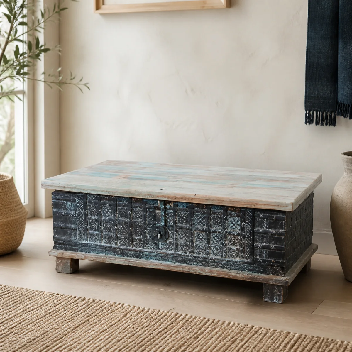 Ombili Whitewash Carved Chest staged in a curated room setting one.
