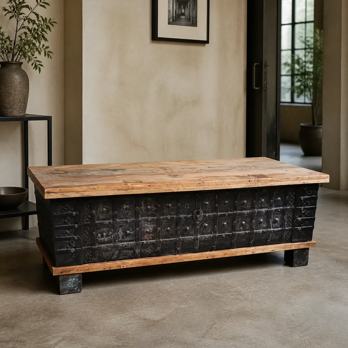 Foundry Riveted Storage Chest staged in a curated room setting one.