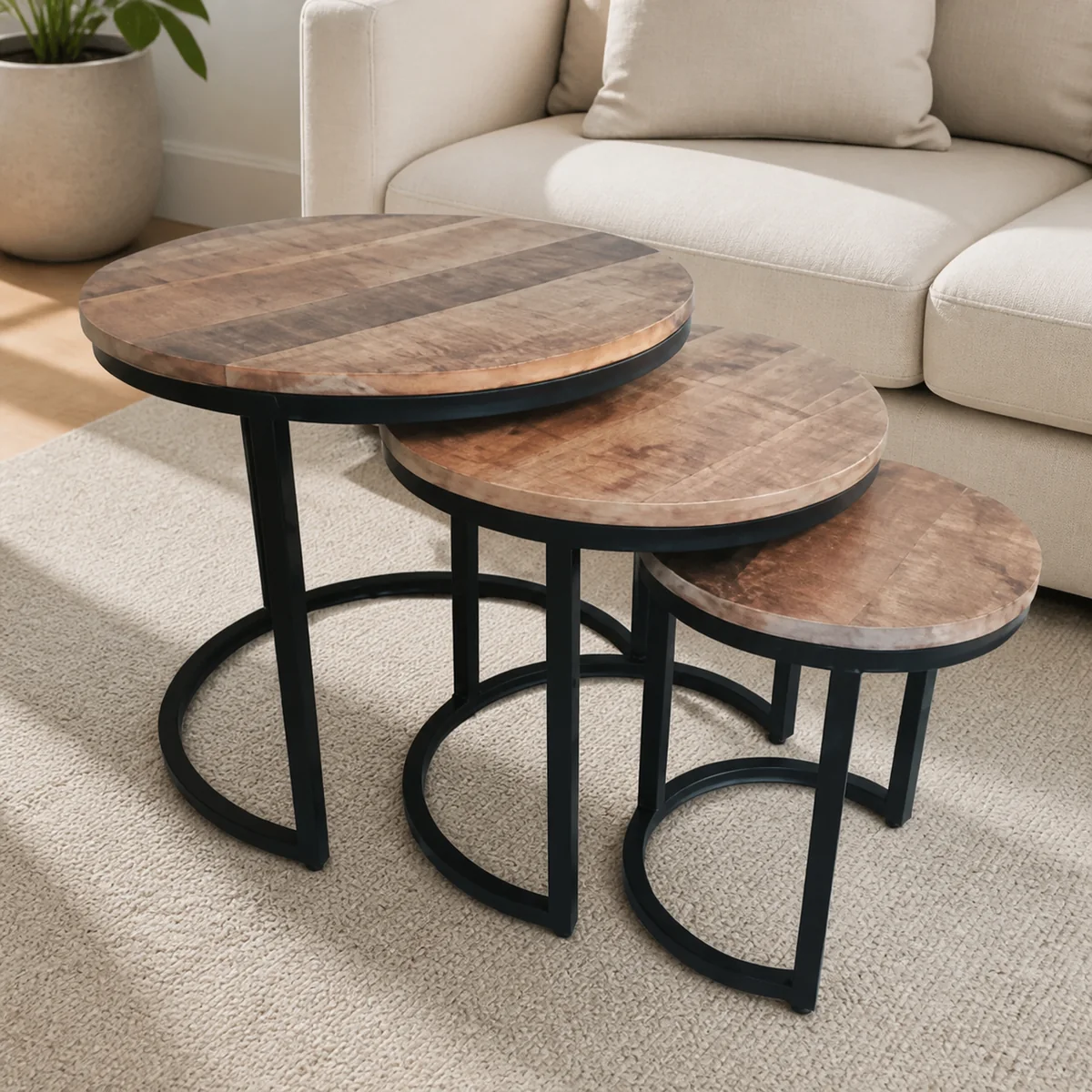 Foundry Round Nesting Coffee Tables staged in a curated room setting one.