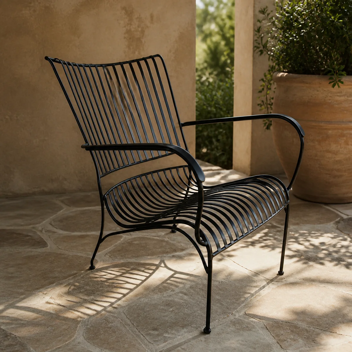 Ripple Wire Garden Armchair staged in a curated room setting one.
