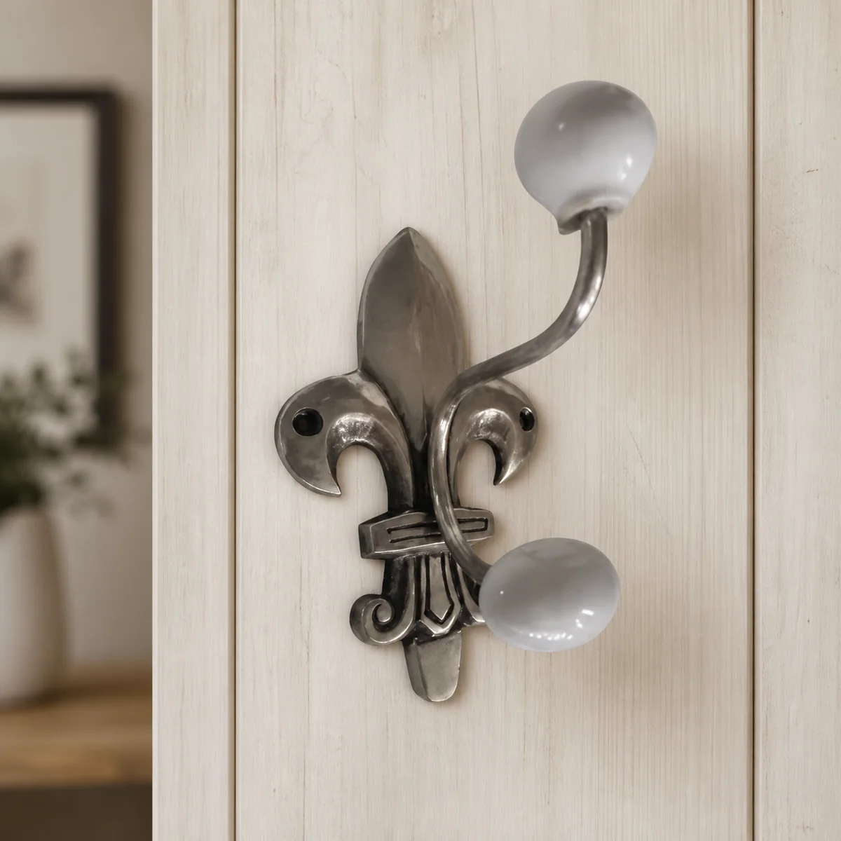 Fleur-De-Lis Triple Wall Hook staged in a curated room setting one.