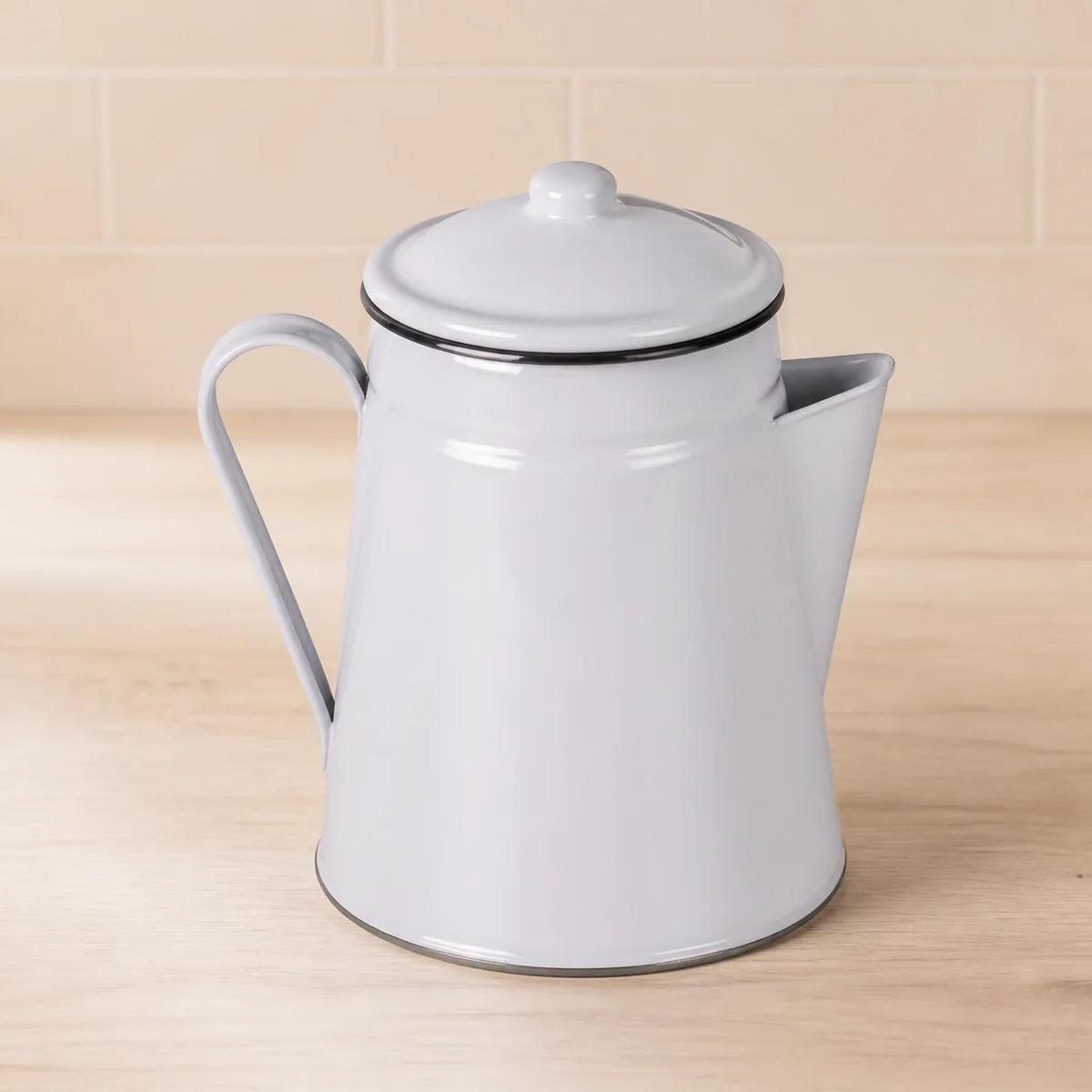 Grey Enamel Coffee Pot staged in a curated room setting one.