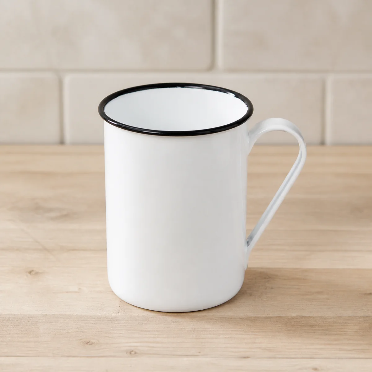 White Enamel Camp Mug staged in a curated room setting one.