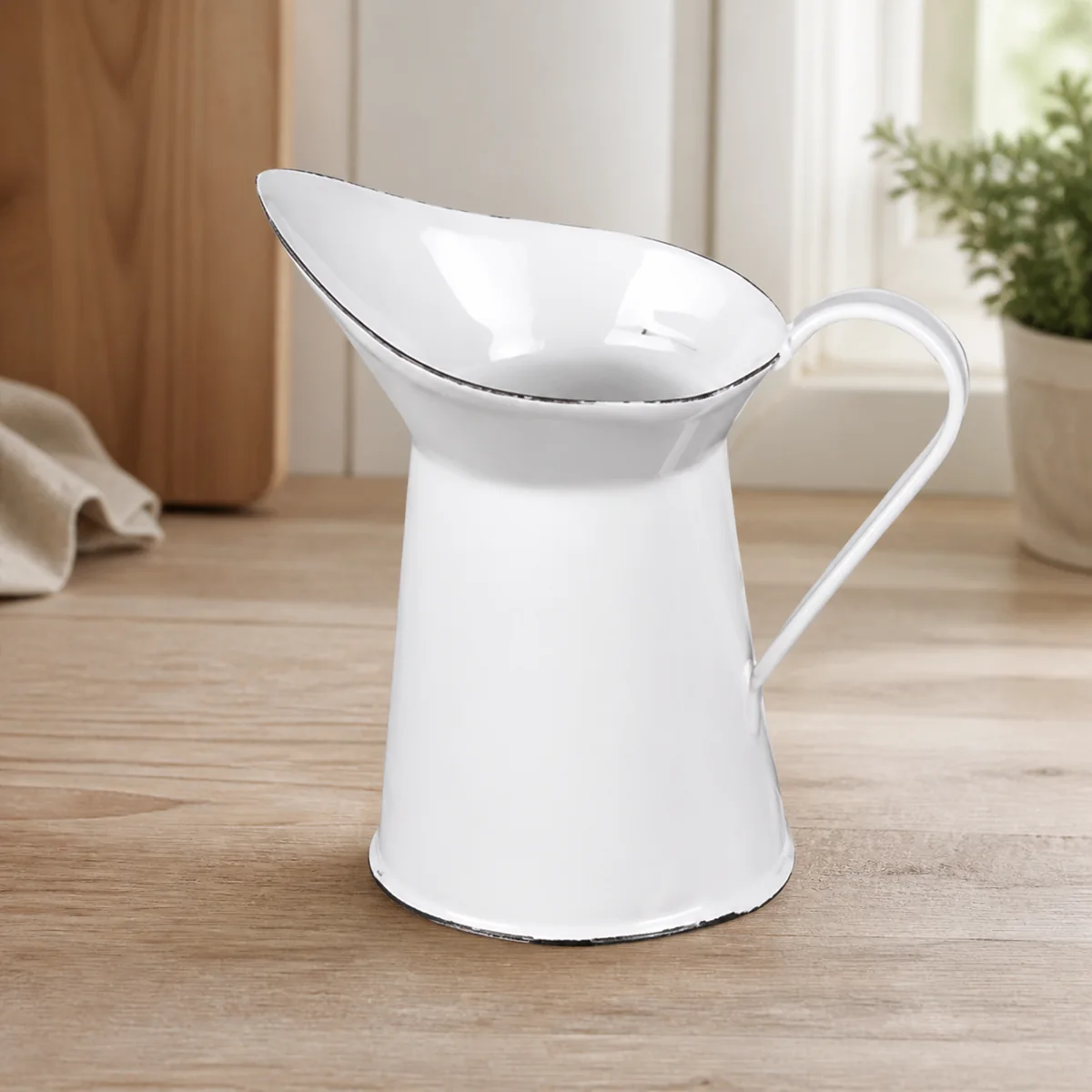White Enamel Water Jug staged in a curated room setting one.