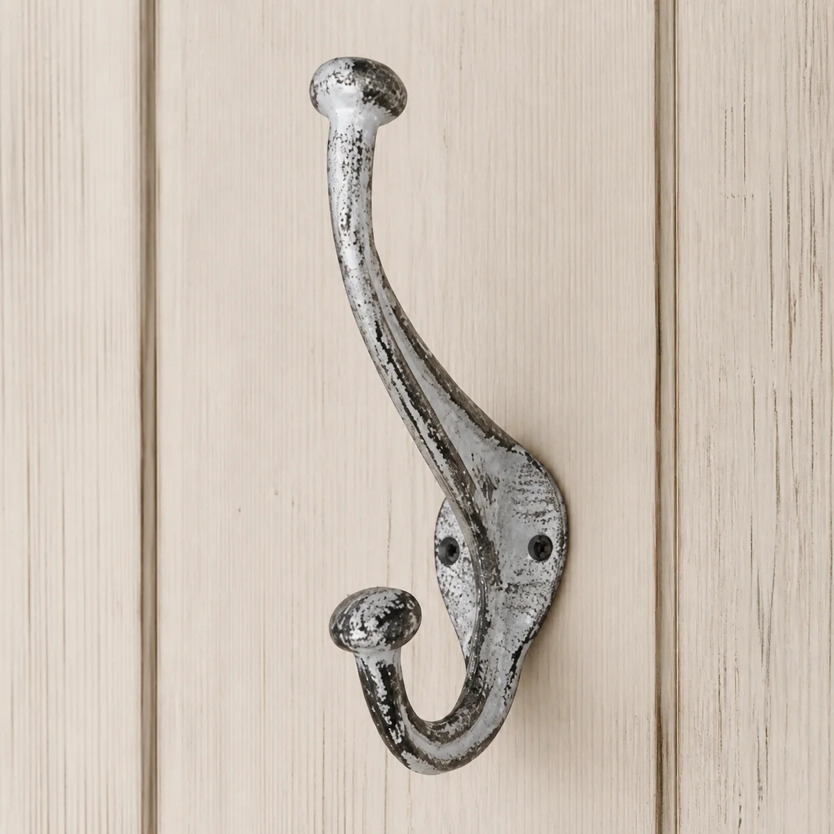 Silver Long-Neck Double Hook staged in a curated room setting one.