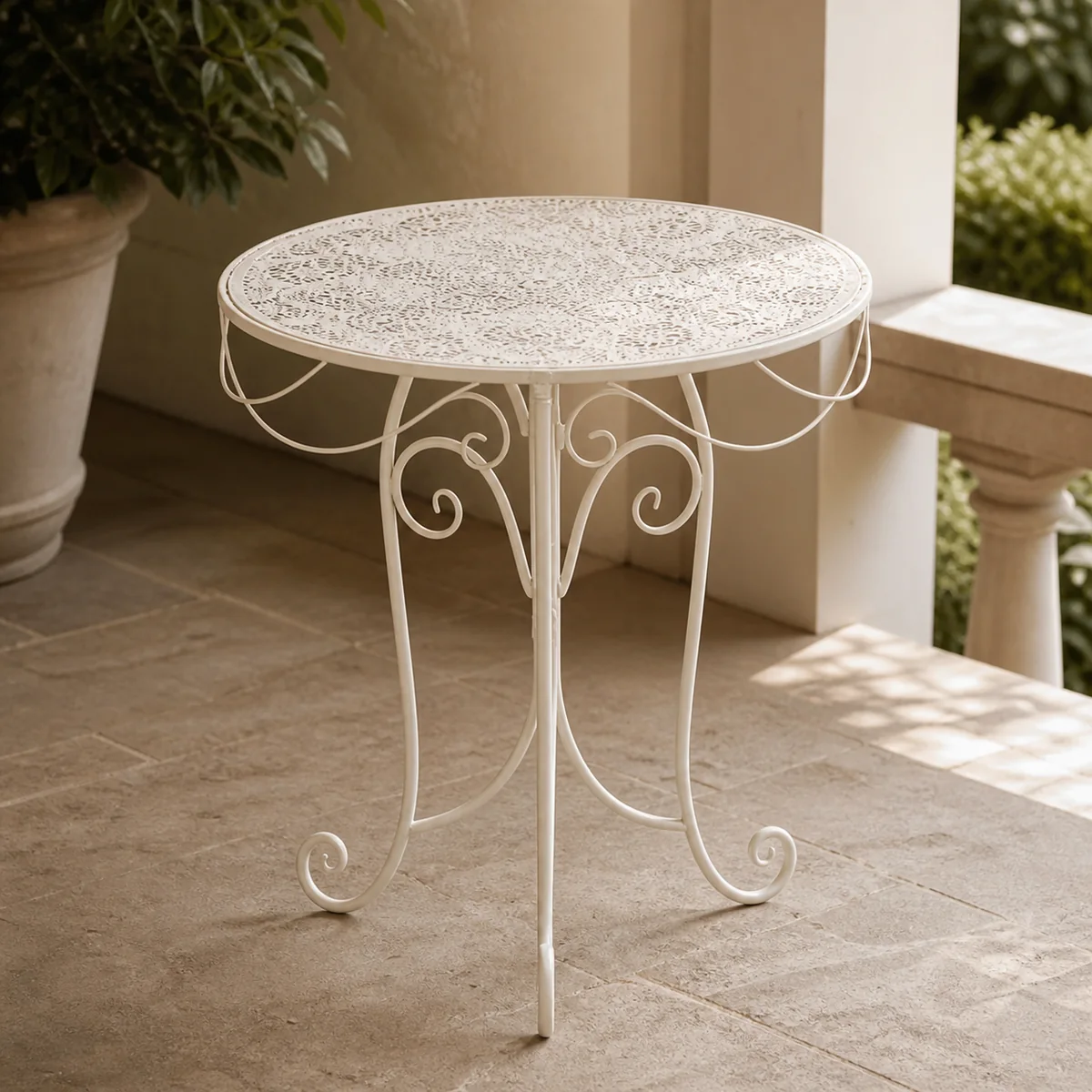 Ivory Scroll Garden Side Table staged in a curated room setting one.