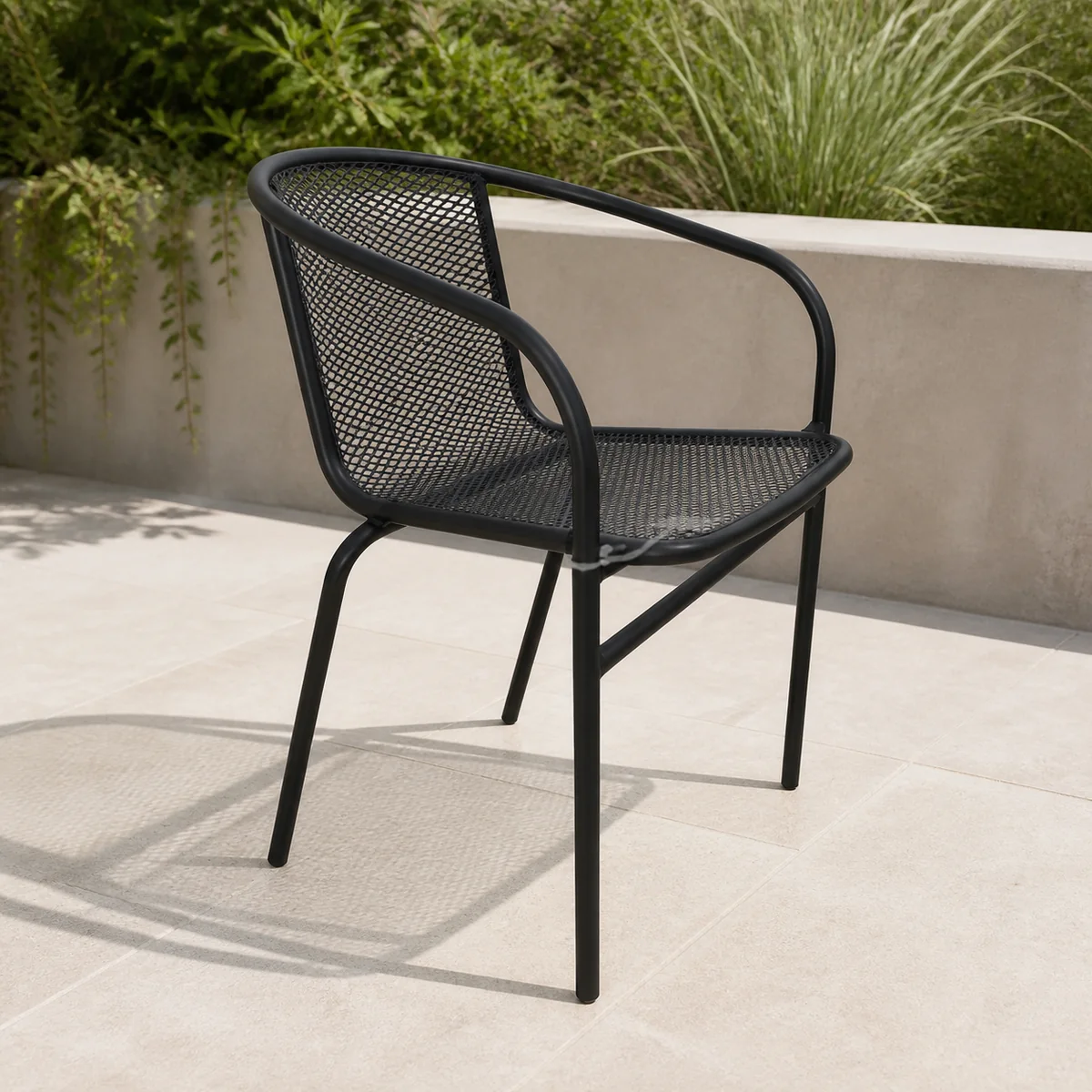 Foundry Mesh Garden Armchair staged in a curated room setting one.