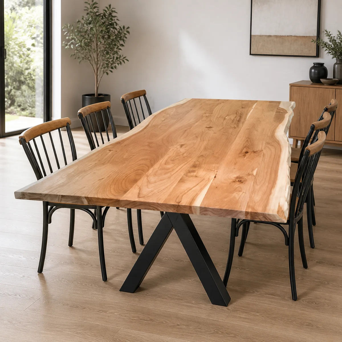 Mopane Trestle Dining Table staged in a curated room setting one.