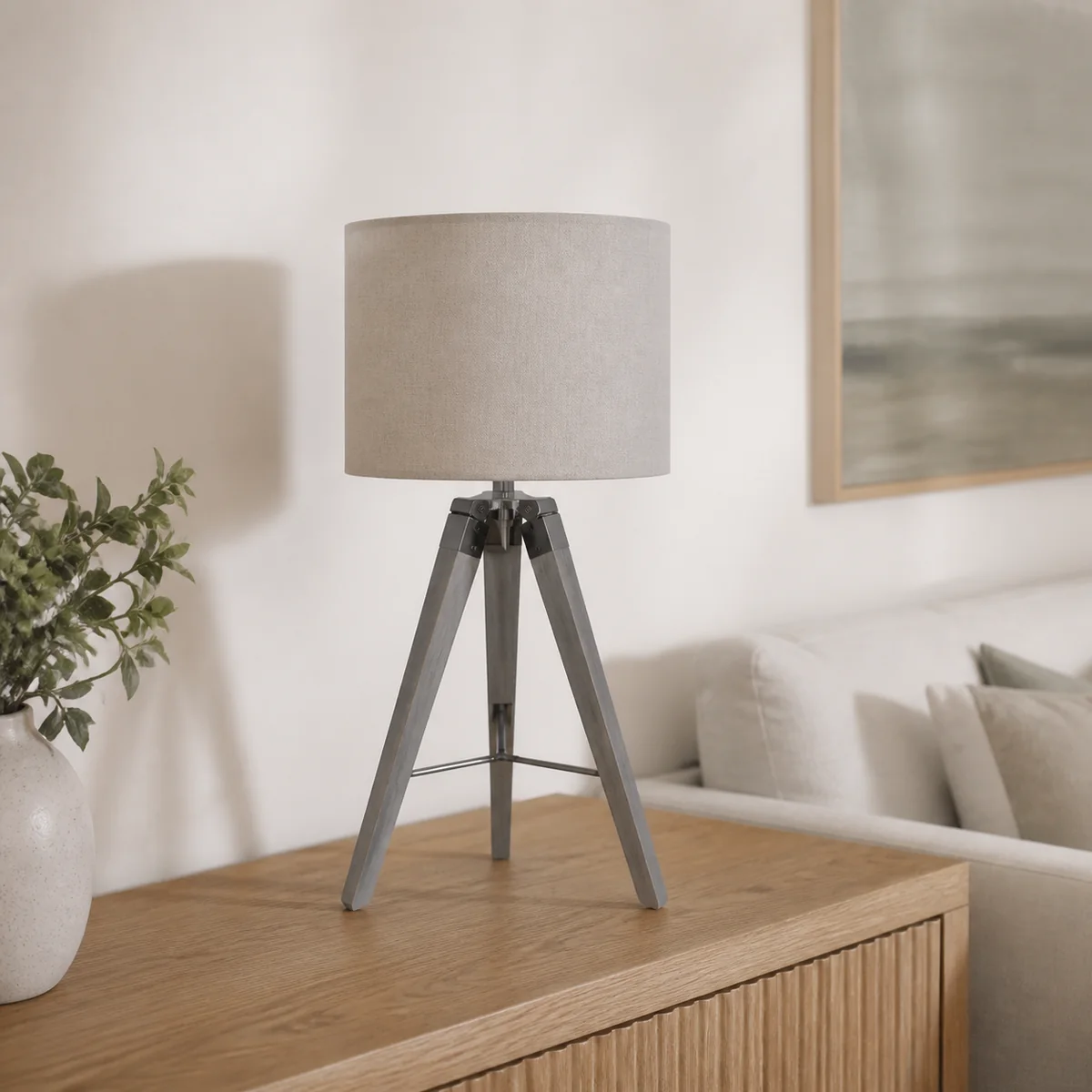 Linen Tripod Table Lamp staged in a curated room setting one.