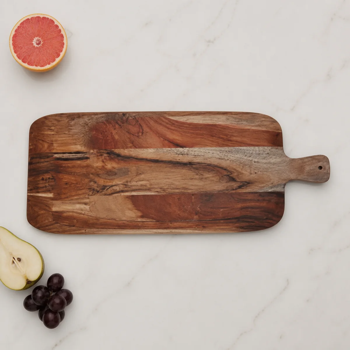 Karas Handled Serving Board staged in a curated room setting one.