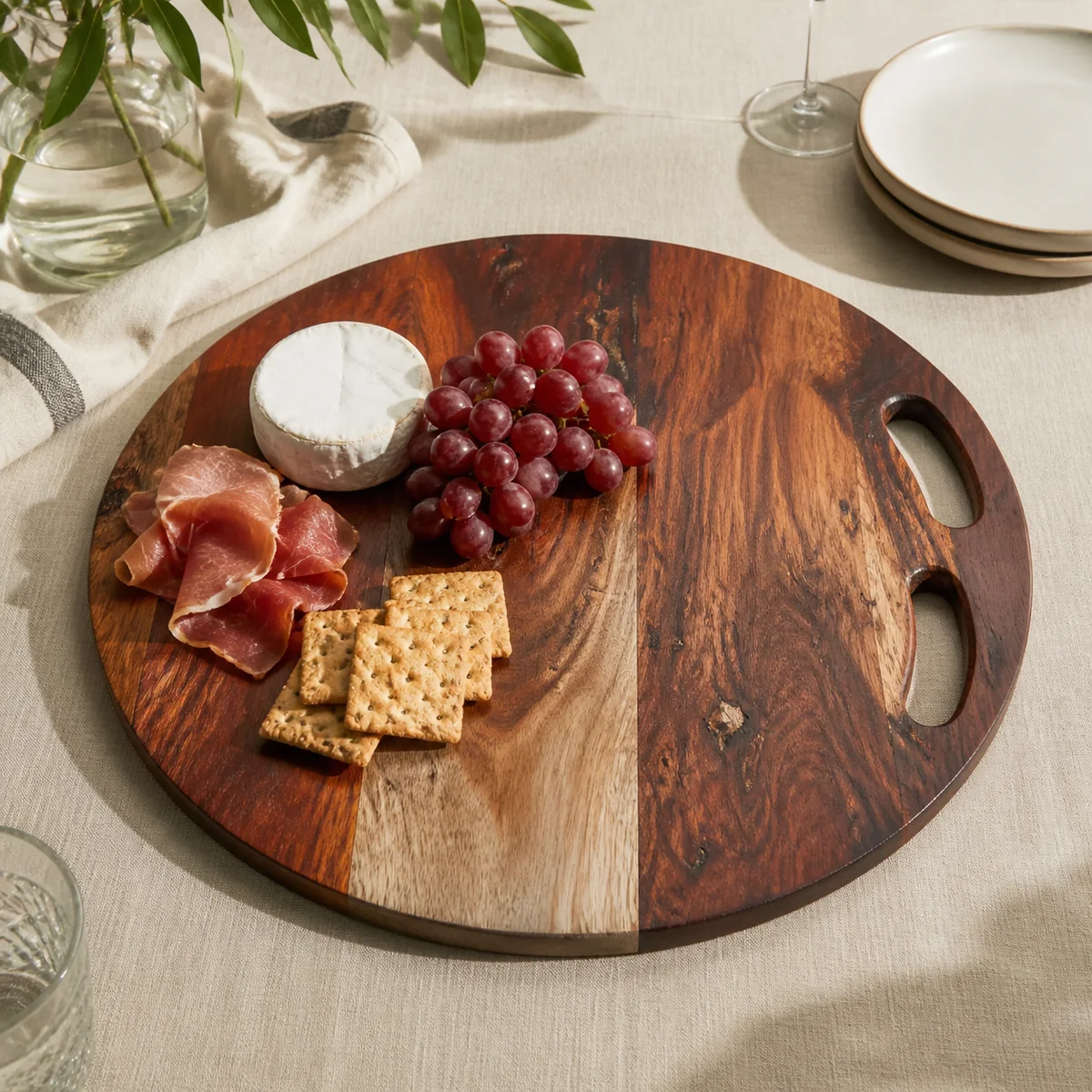 Ongava Round Handled Board staged in a curated room setting one.
